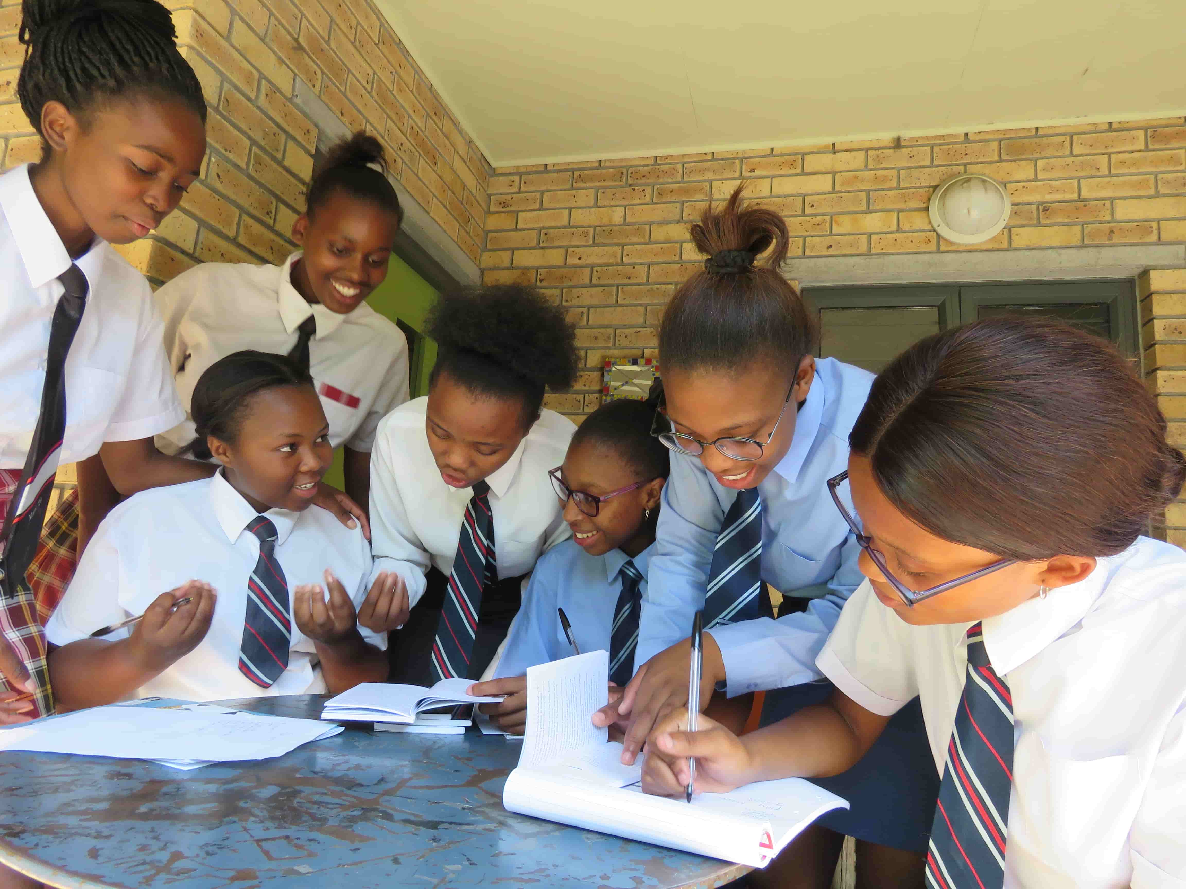 A group of learners collaborating during a writing workshop